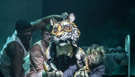 Richard Parker tiger puppet from Life of Pi being manipulated by puppeteers
