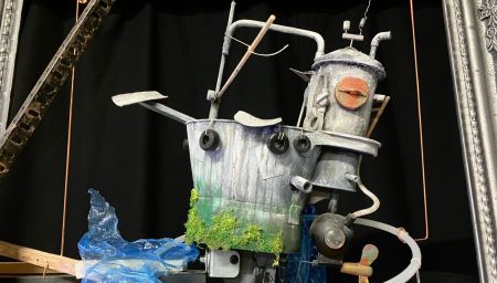 Image of motorised puppet made from buckets and pipes