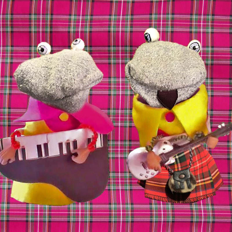 Two sock puppets playing musical instruments