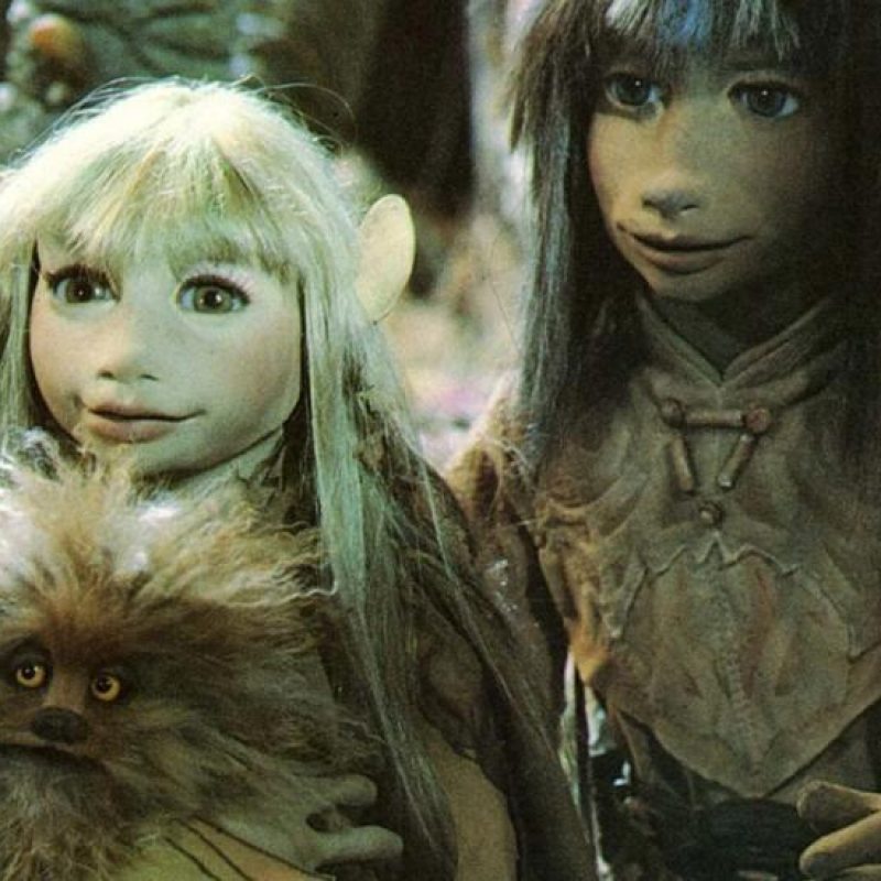Two puppets from the film The Dark Crystal look to camera