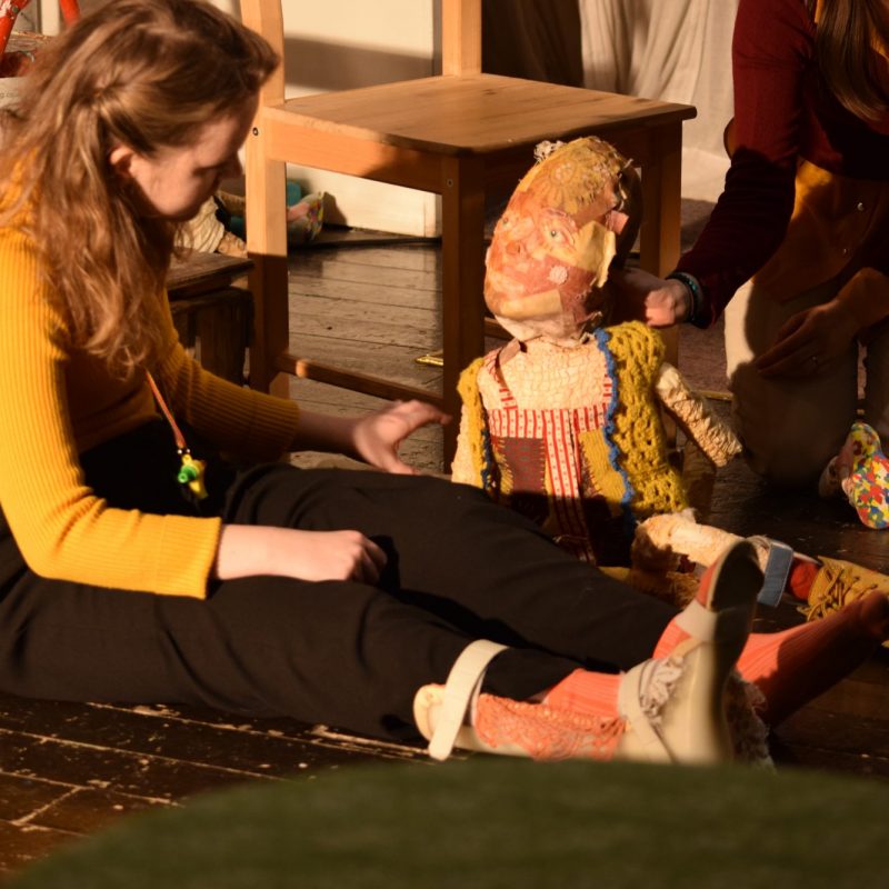Puppeteer operating a puppet with Cerebral Palsy