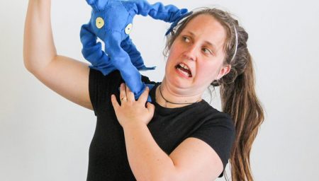 Woman with puppet on her shoulder